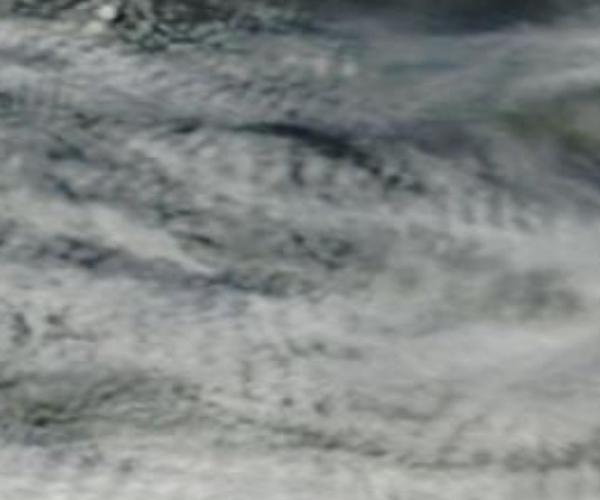 Signature of a weather weapon. A circular indentation in cloud to west of South Island